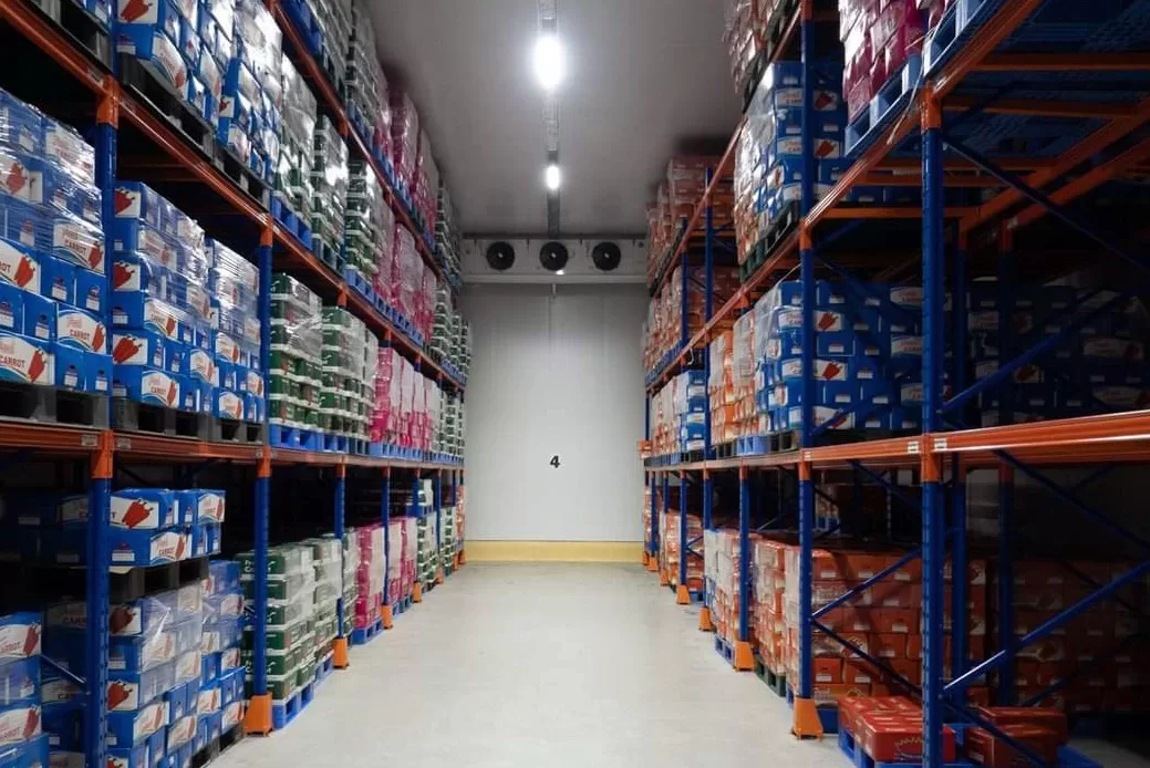 Unity Marketing Corporation warehouse aisle stocked with refrigeration and air-conditioning inventory